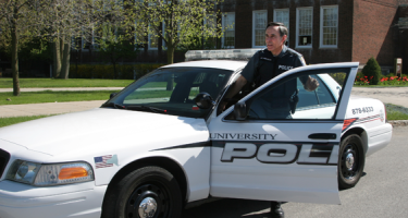 image of UPD officer leaving patrol vehicle